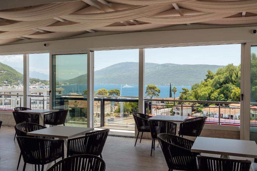 Breakfast room at Centar Novi with sea and mountain views